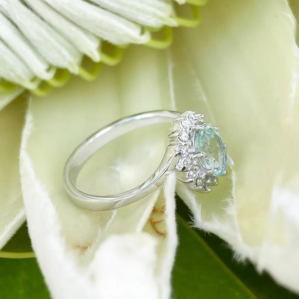 Timeless With A Twist Oval Aquamarine with Diamond Halo Ring